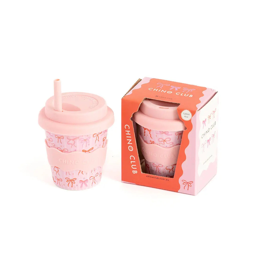 Pink tumbler with straw and decorative pattern, accompanied by its packaging box on a white background.