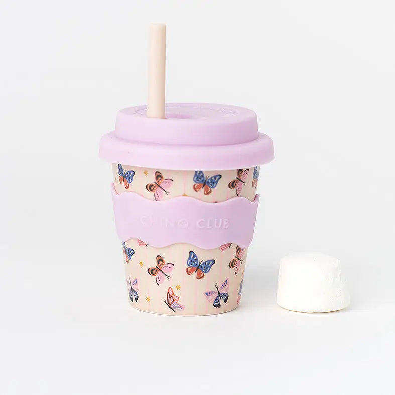 Reusable cup with butterfly design and pink lid on a white background