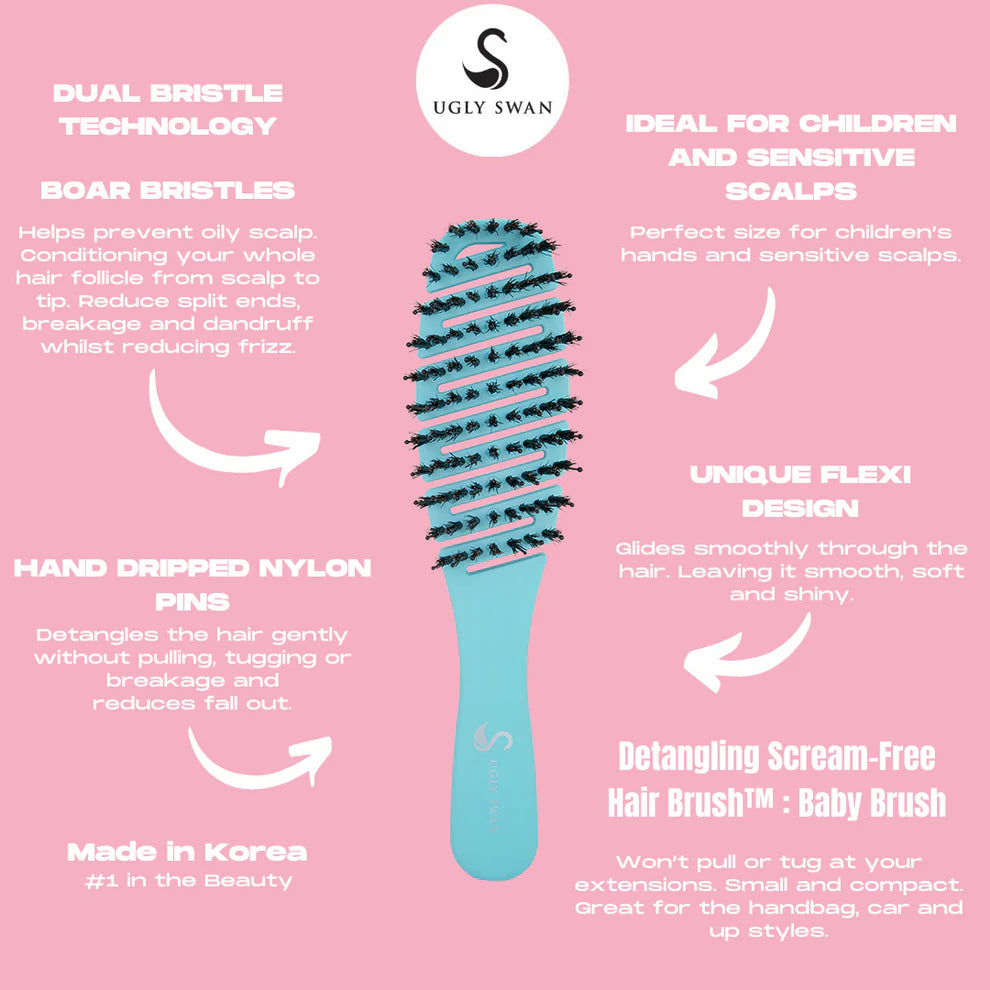 Detangling hair brush with Ugly Swan branding on a pink background
