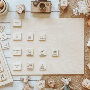 Set of wooden stamps on a wooden board with a rustic background