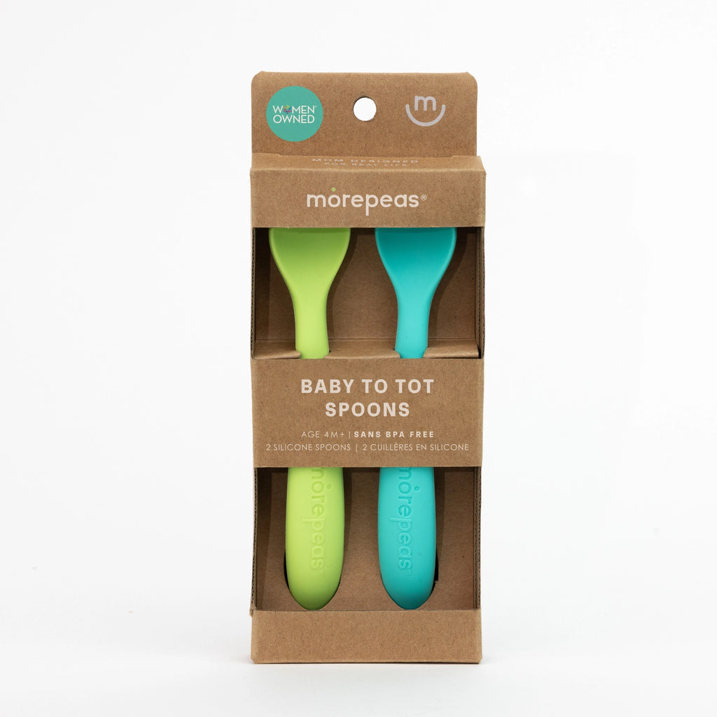 Packaging of two green and blue baby spoons with 'morepeas' branding on a white background.