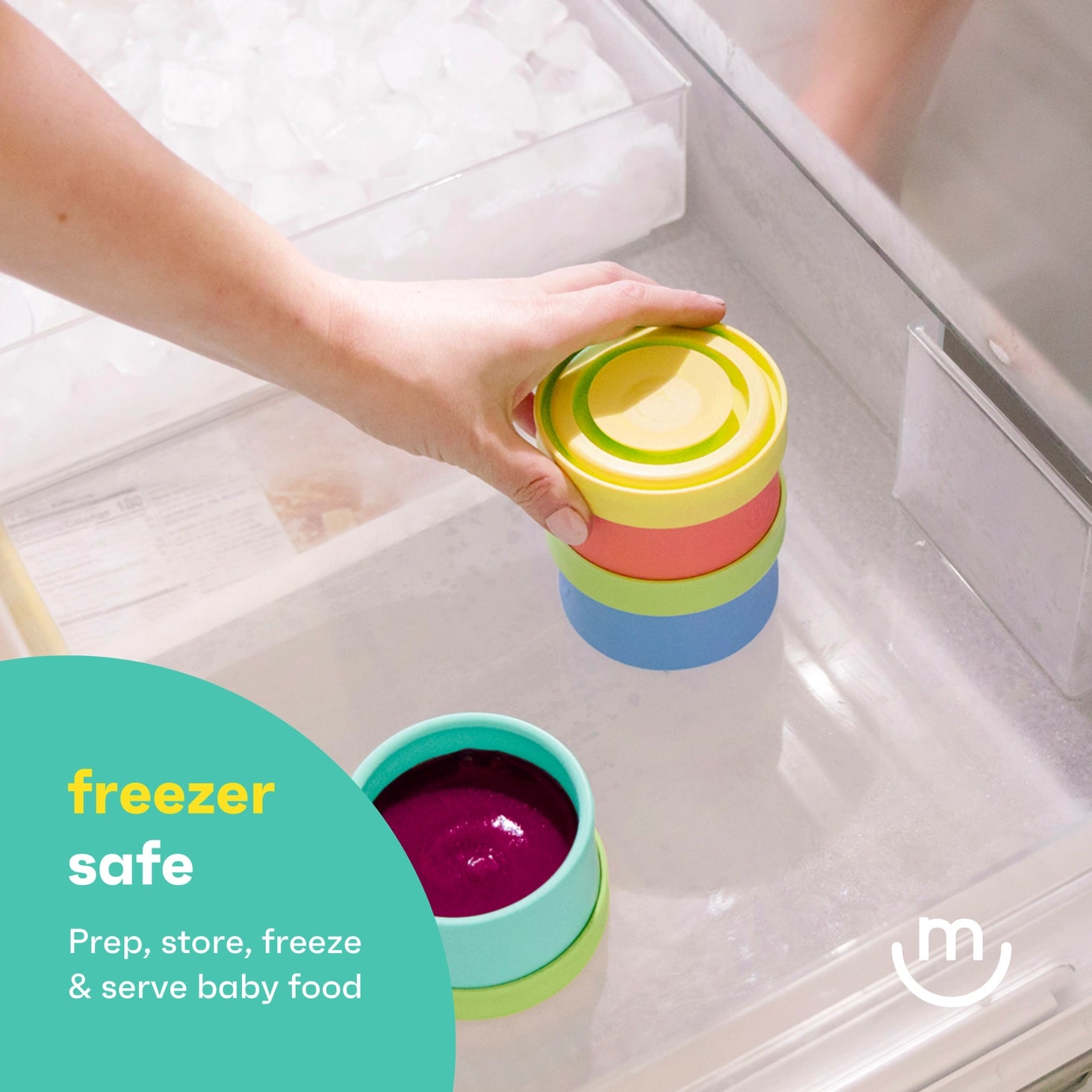 Colorful baby food containers being stacked in a refrigerator with 'freezer safe' text and logo.