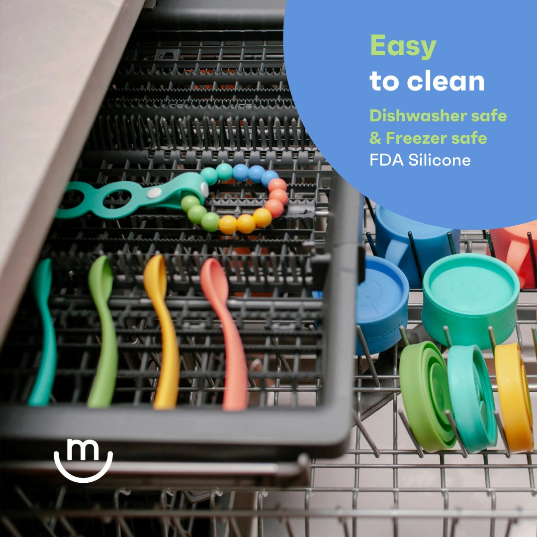 Colorful silicone utensils in a dishwasher with text about safety features.