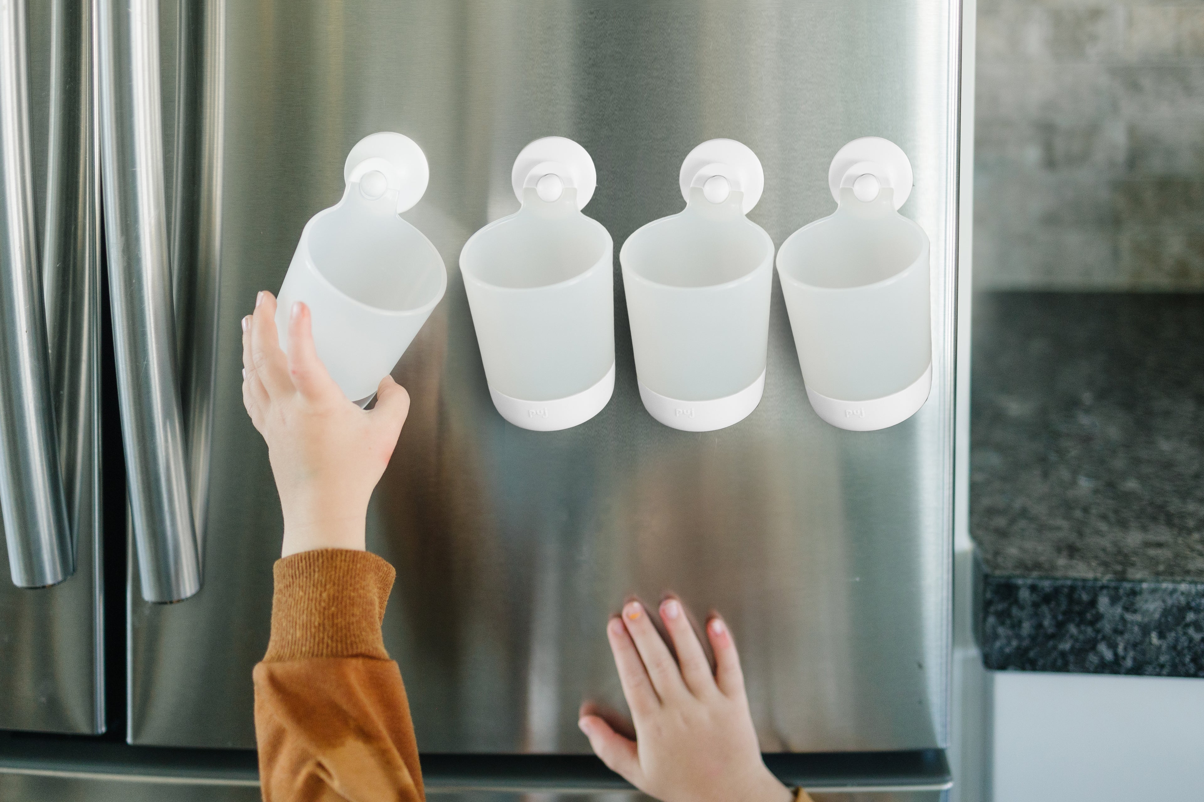 hangable kids cups on the fridge
