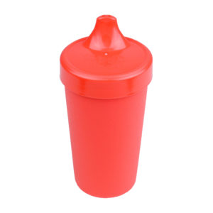 Red sippy cup on a white background