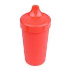 Red sippy cup on a white background