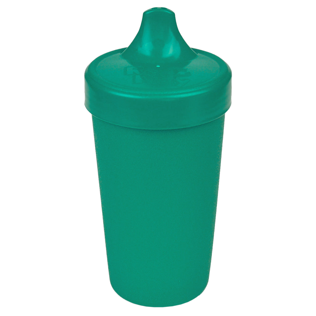 Green sippy cup on a white background