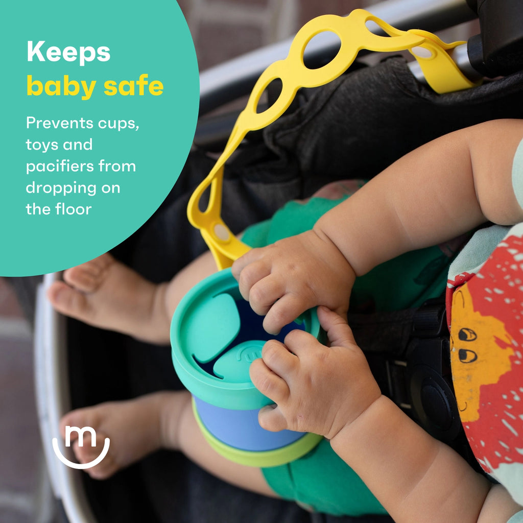 Child's hands holding a stack of colorful cups with a safety device in a car seat, text 'Keeps baby safe' and 'Prevents cups, toys and pacifiers from dropping on the floor'.