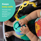 Child's hands holding a stack of colorful cups with a safety device in a car seat, text 'Keeps baby safe' and 'Prevents cups, toys and pacifiers from dropping on the floor'.