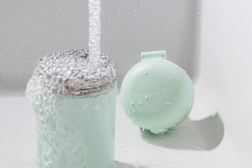 Mint green water dispenser with 'bonnyC' branding on a white background