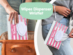 Wipes dispenser wristlet with Bumco branding held by a person.