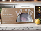 Boxed kids' kitchen set with Montessori Mates branding on a kitchen counter.