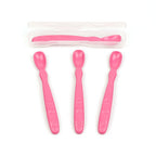Set of three pink baby spoons with a clear plastic case on a white background