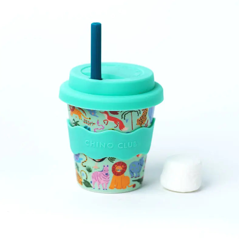 Reusable cup with animal pattern and turquoise lid and straw on a white background