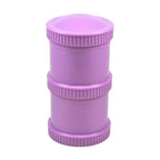 Purple cylindrical container with a lid on a white background